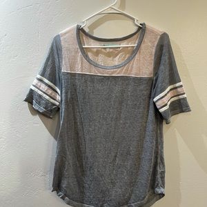 Dark grey, pink, and white. Size Medium